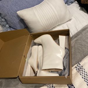 White booties, never been worn I got them for a vacation that I didn’t go on!